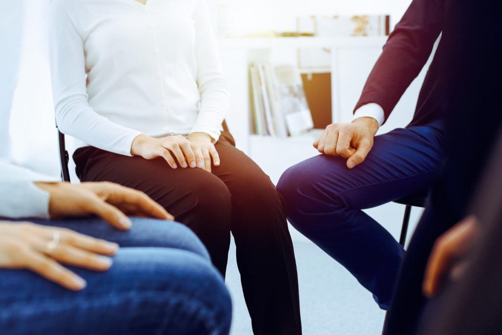 group people sitting circle during therapy office meeting business team participating training min